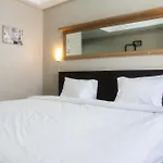 Minimalist Studio The Oasis Apartment near Omni Hospital Cikarang By Travelio