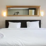 Minimalist Studio The Oasis Apartment near Omni Hospital Cikarang By Travelio